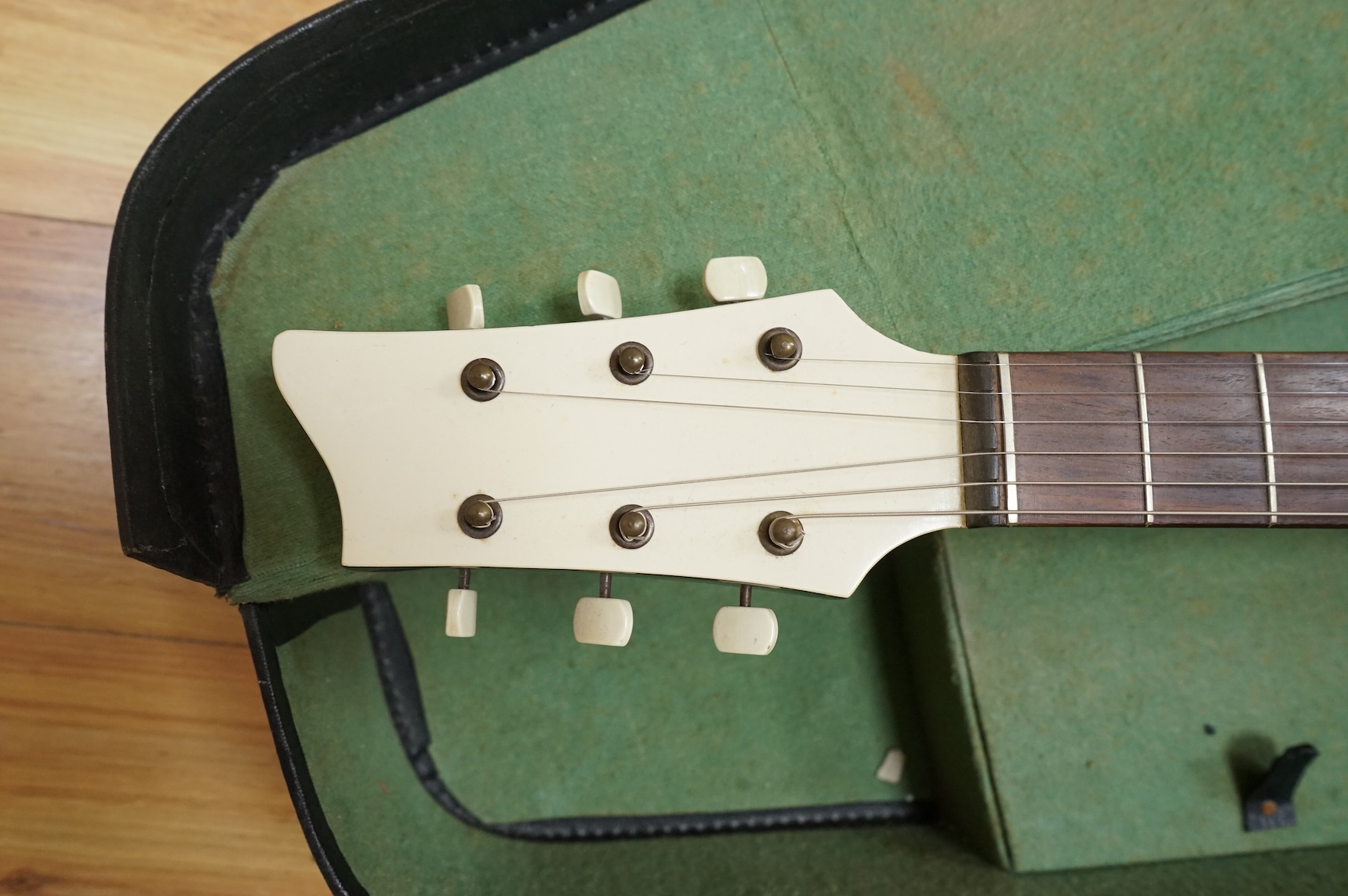A 1950's Hofner style cut-away acoustic guitar, fitted with a pick up bearing Hofner engraved signature, with hard case.
